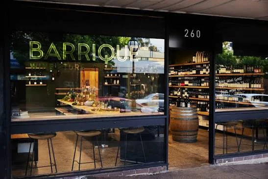 Barrique Wine Store’s glass storefront and wine displays