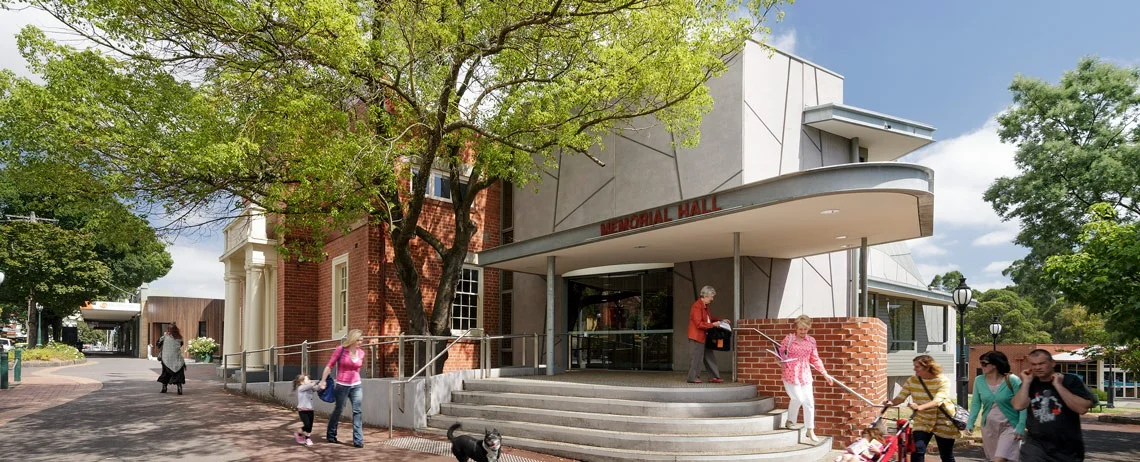 The Memo Healesville’s Memorial Hall entrance beneath leafy trees