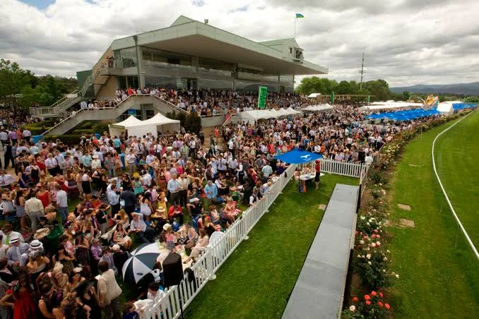 Race-day crowds beside the grandstand at Yarra Valley Racecourse